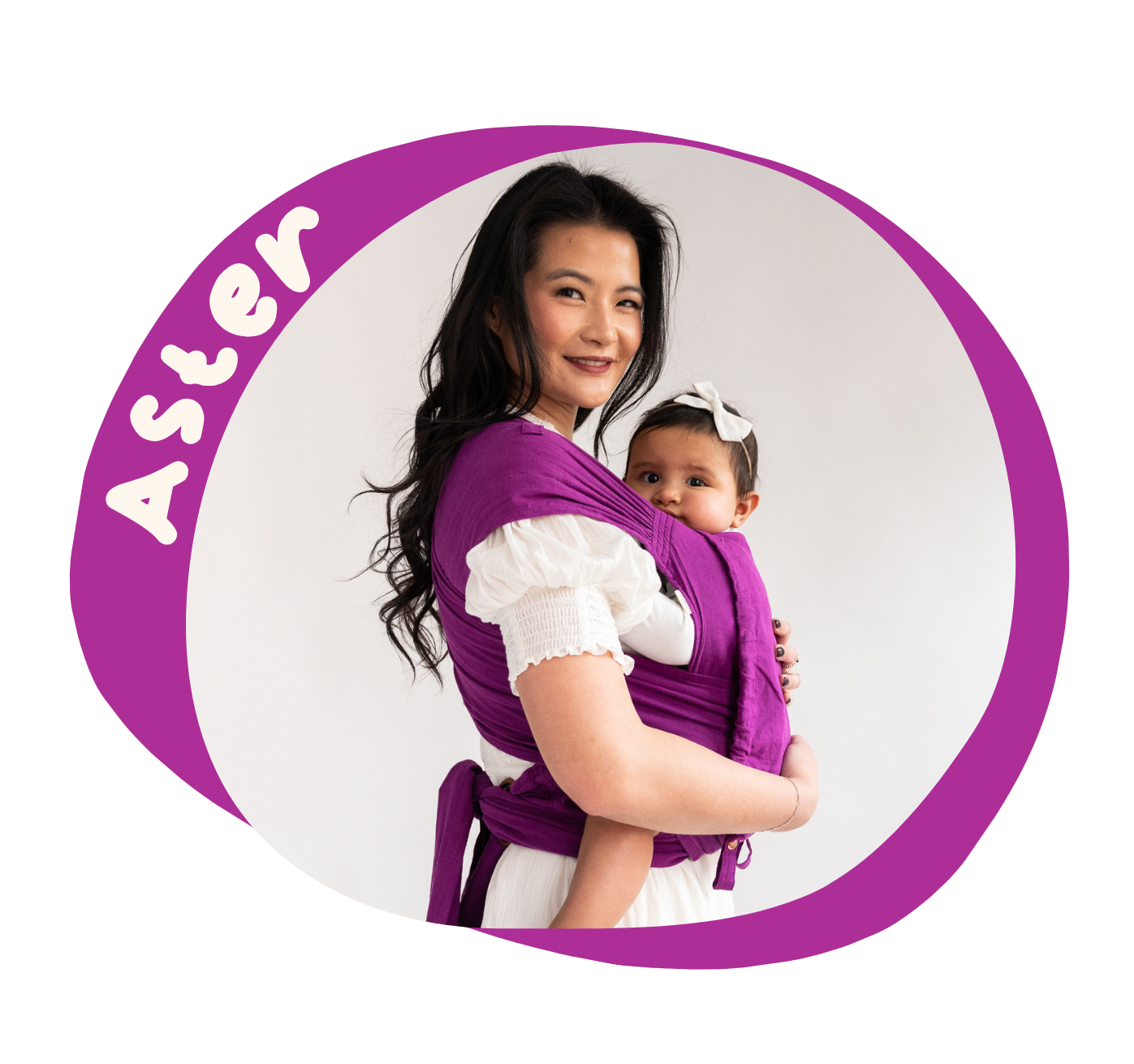 An asian woman wears a rich purple meh dai carrying her daughter. Her arms wrap around the baby gently. The image is bordered by the same purple, with the heading 'Aster'.