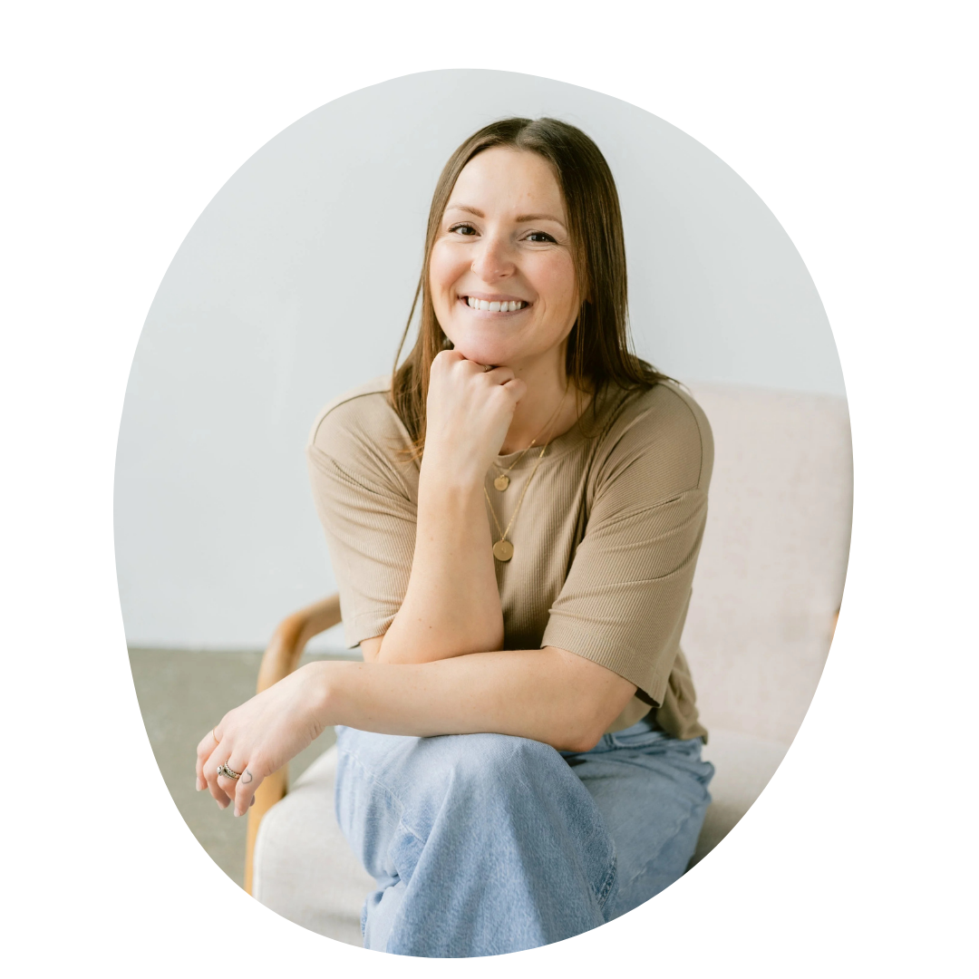 Woman sitting on a chair with a plain background
