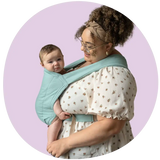 Plus size mother wearing her infant in a blue buckle carrier.