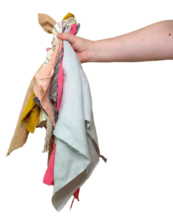 Handful of fabric scraps saved from landfills