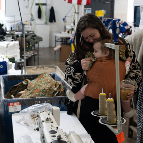 Factory setting with workers and American flag