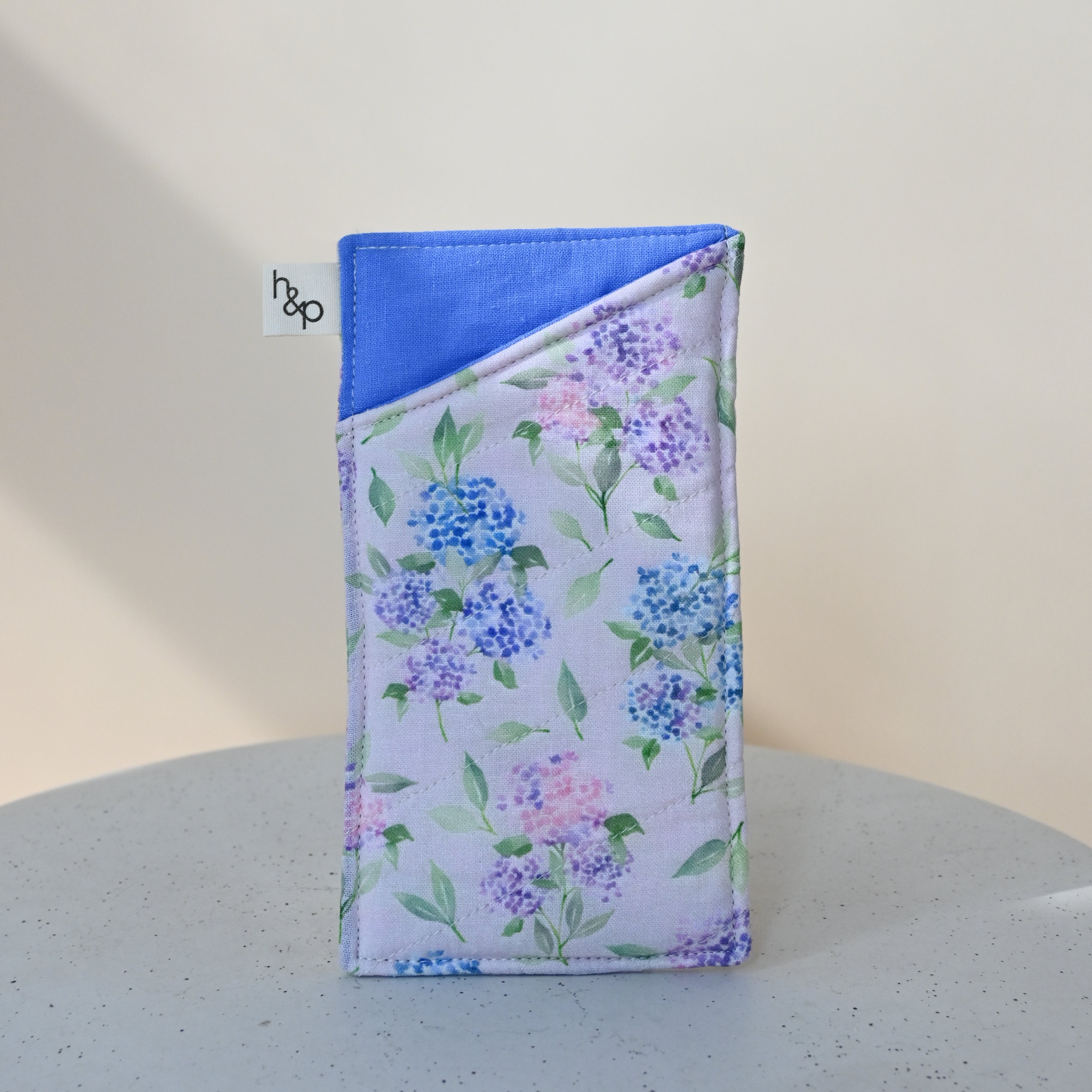 Soft Glasses Case in Blush — padded case with periwinkle-blue trim, blue and lavender hydrangea print on a soft pink background.