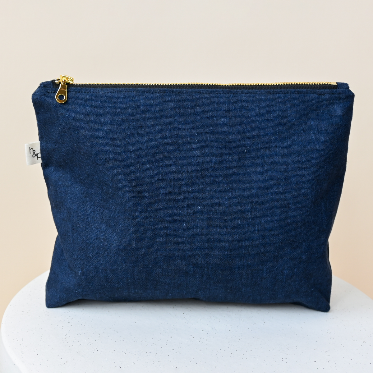Large Flat Bottom Bag in Caspian, a standing zip pouch, deep indigo woven chambray with the look of dark denim.