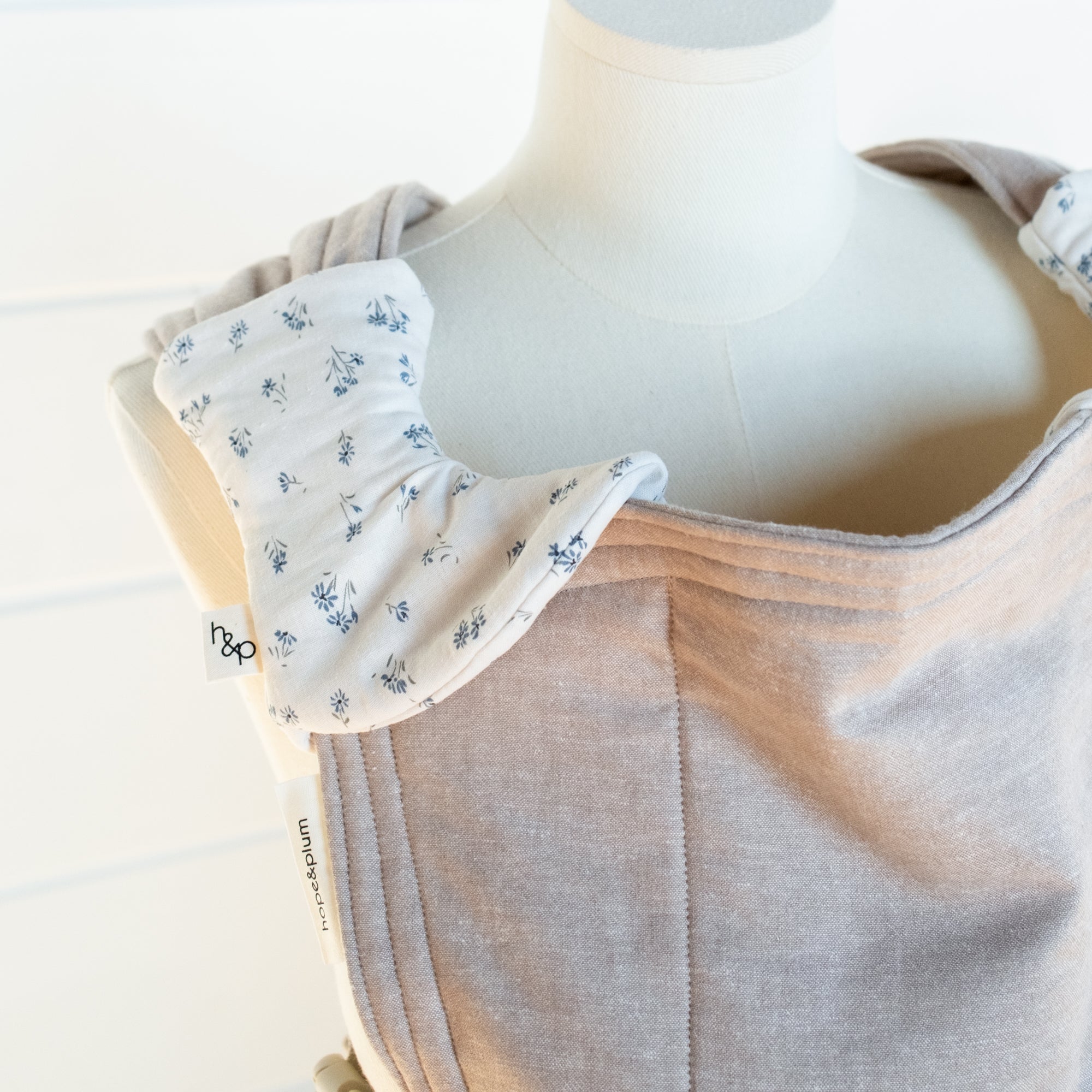 floral pattern drool pads on a mannequin with a white background