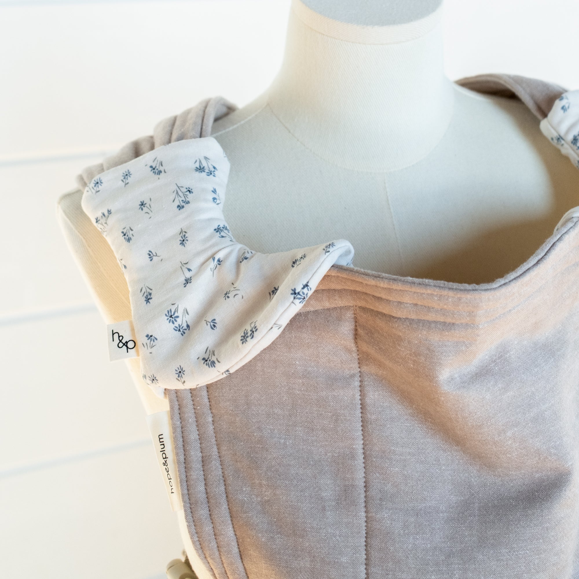 floral pattern drool pads on a mannequin with a white background