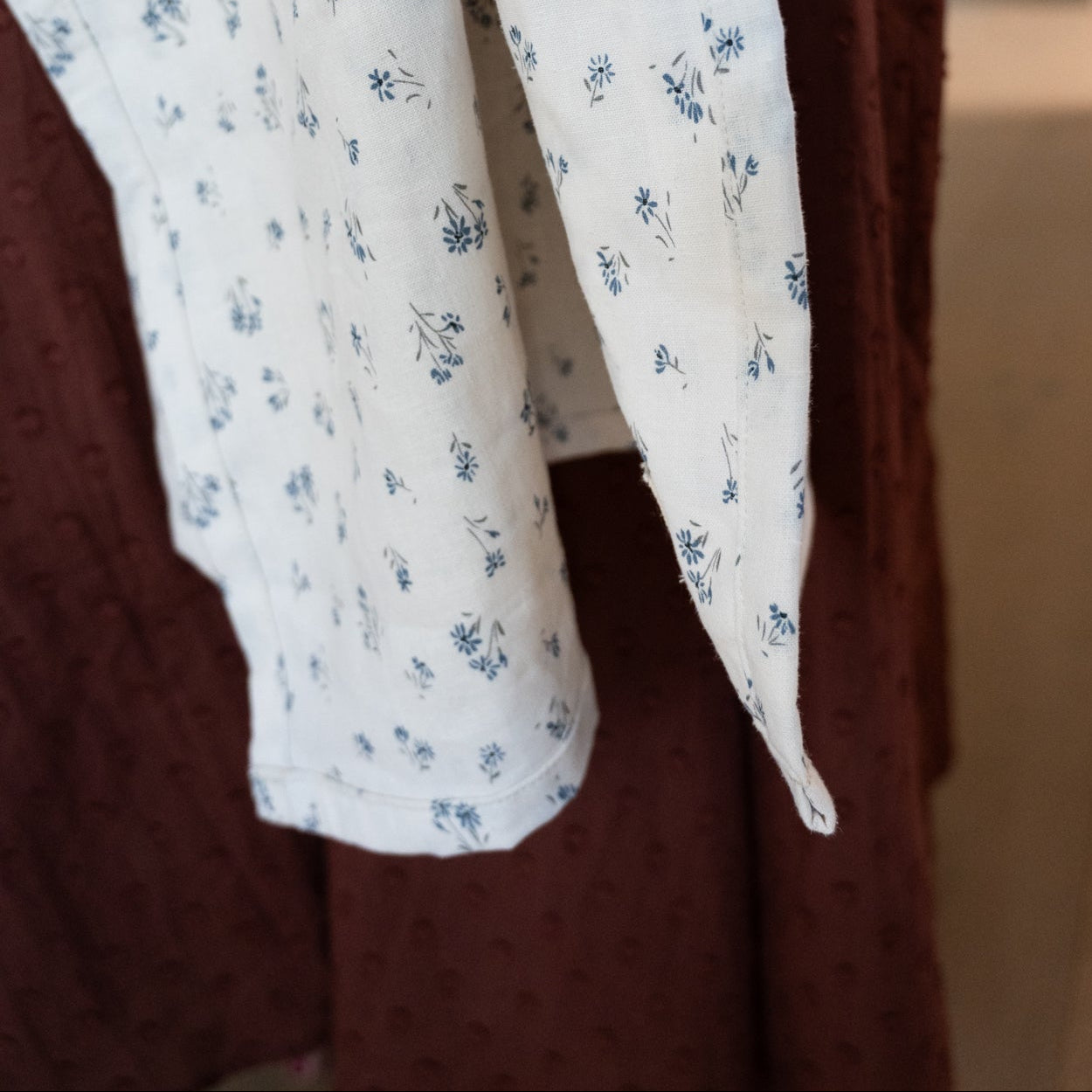 Floral-patterned fabric draped over a dress