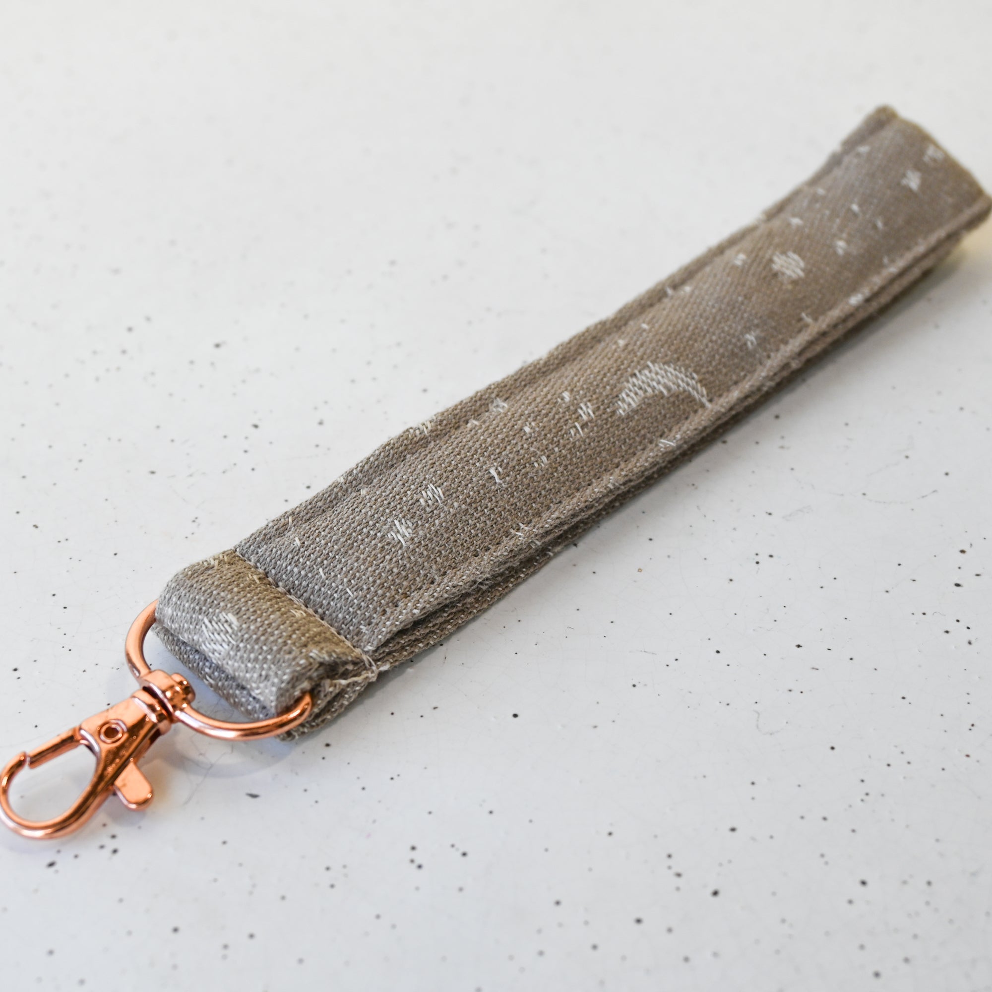 a moon and star print taupe keyfob