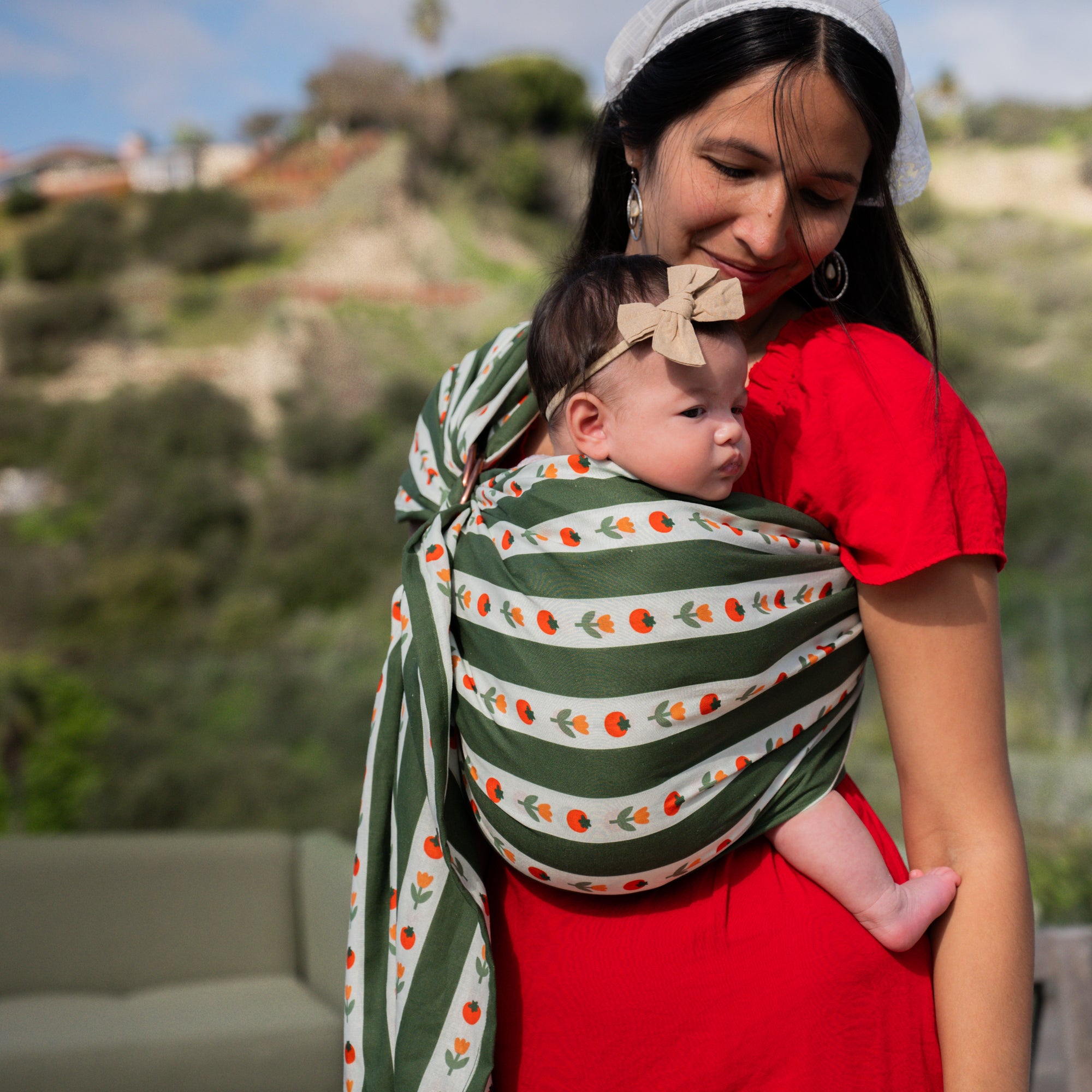 hope&plum Medley ring sling deep green stripe tomato and floral print front carry baby