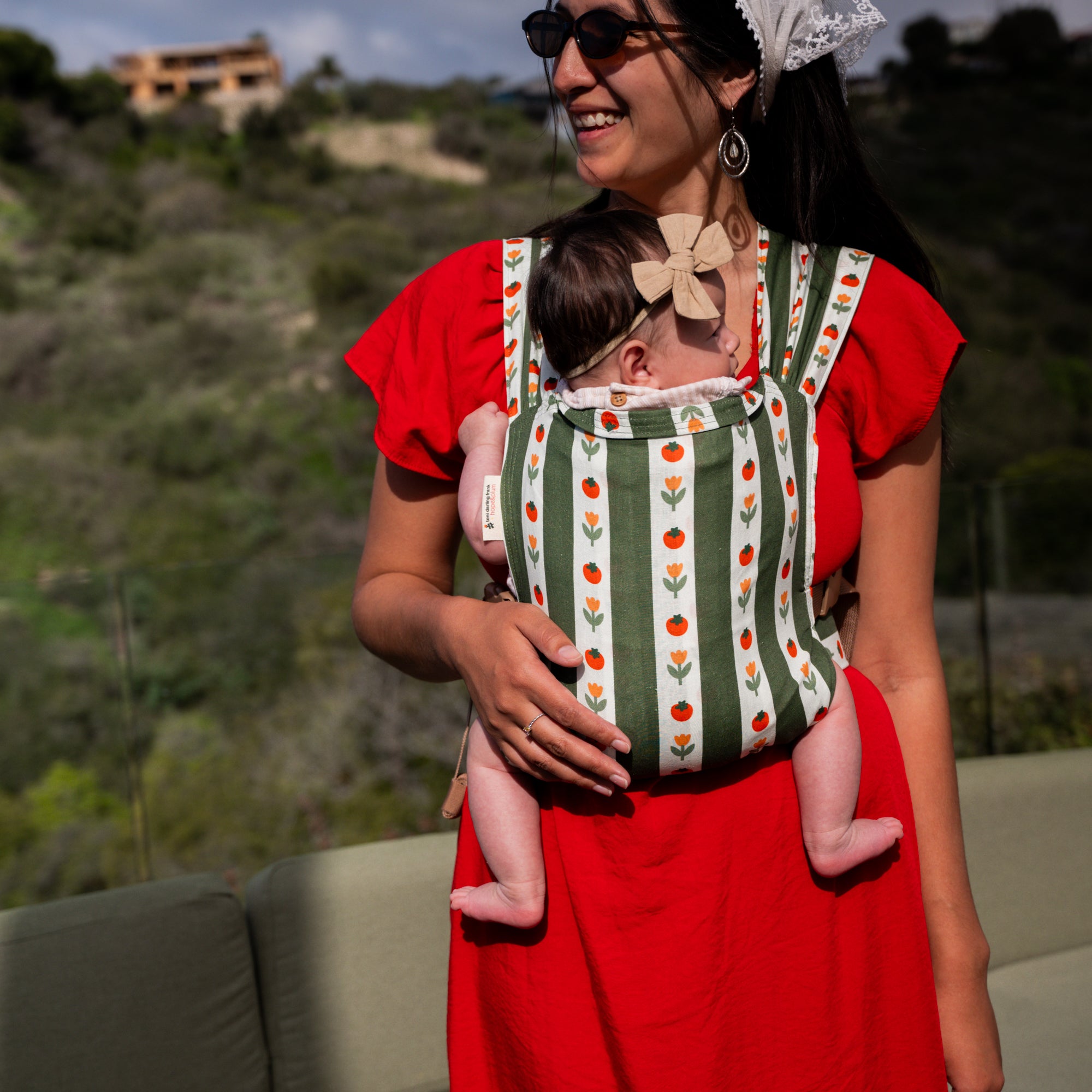 Medley - Sprout Baby Carrier - hope&plum carriers - green and white striped carrier with tomatoes and tulips on the white stripe