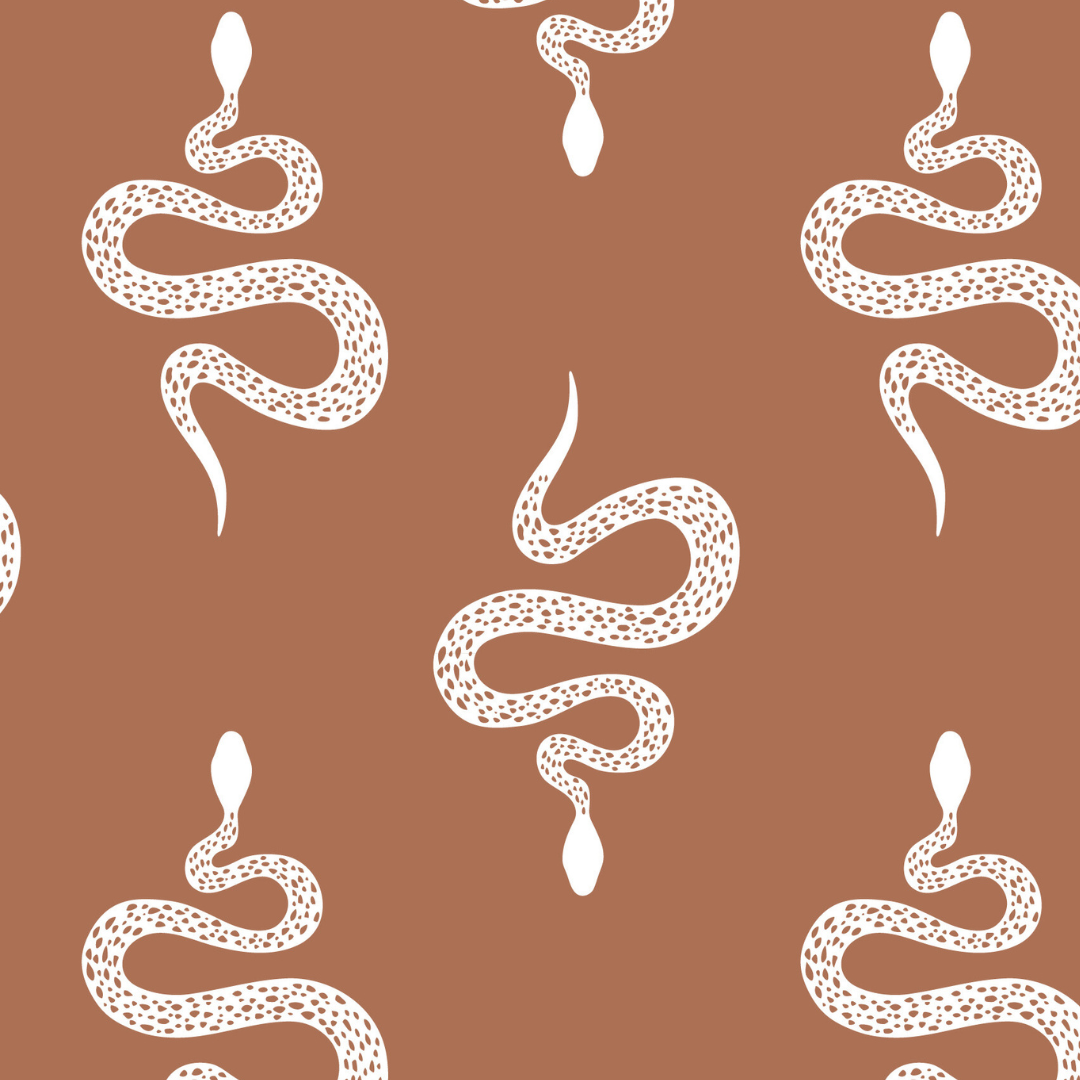 a caramel brown background with white folk-style snakes.