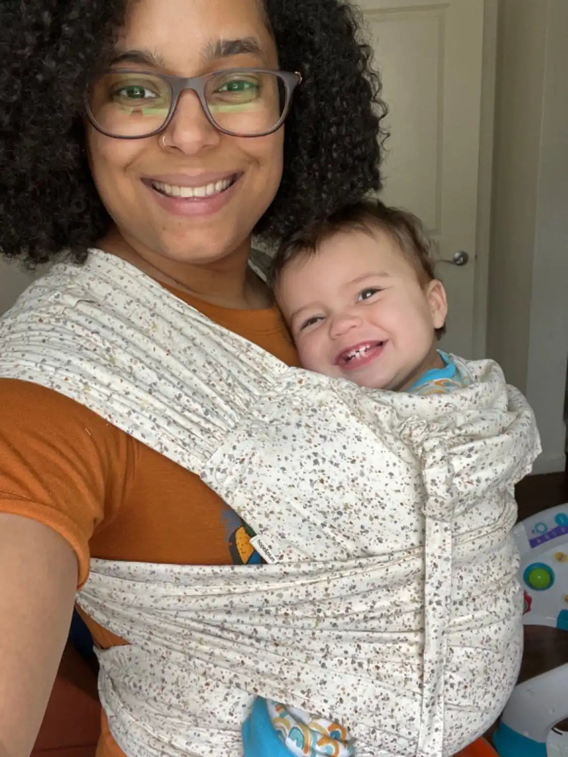 Mother with baby in meh dai baby carrier