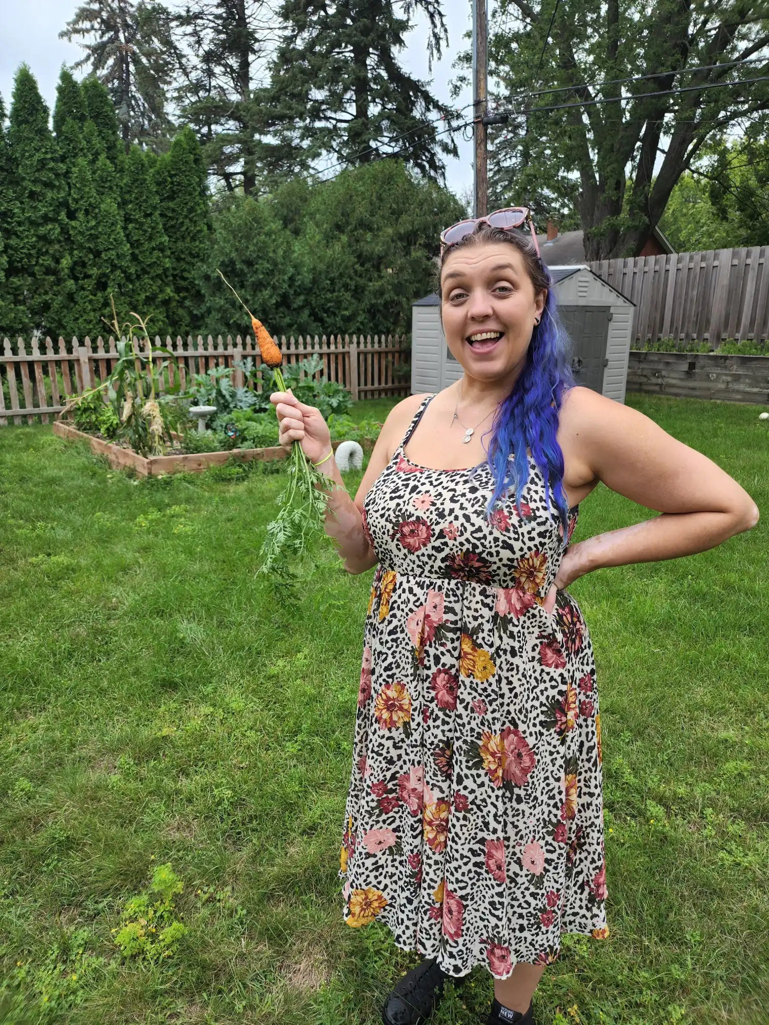 Woman holding carrot.