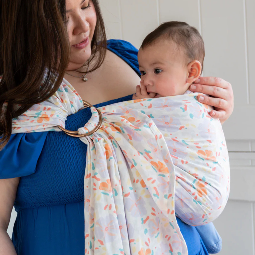 Baby in ring sling showing correct ergonomic positioning