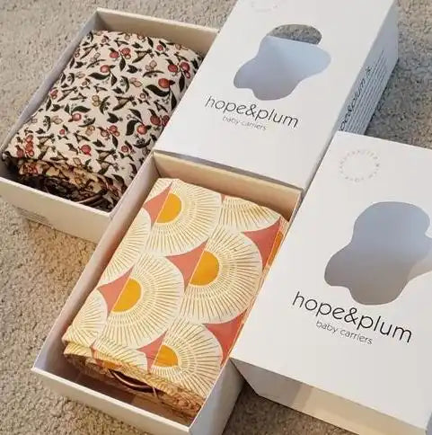 Baby carriers in boxes.