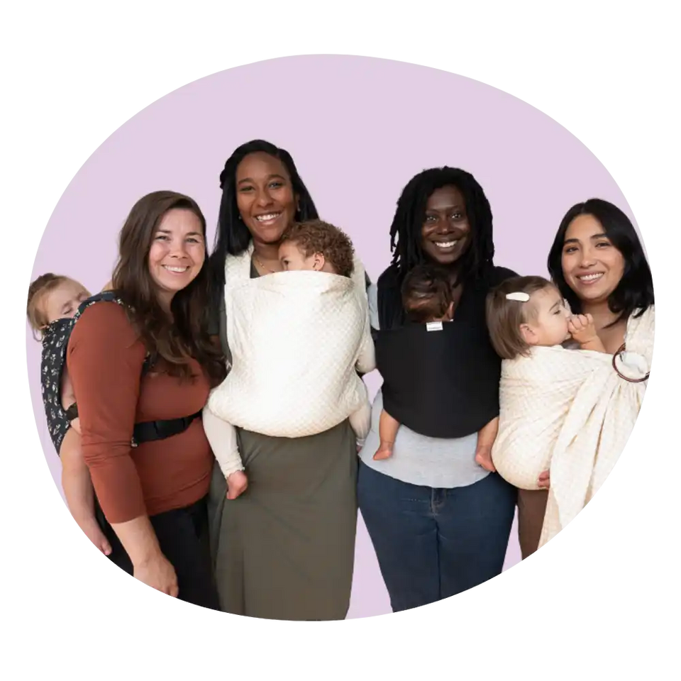 Group of women babywearing.