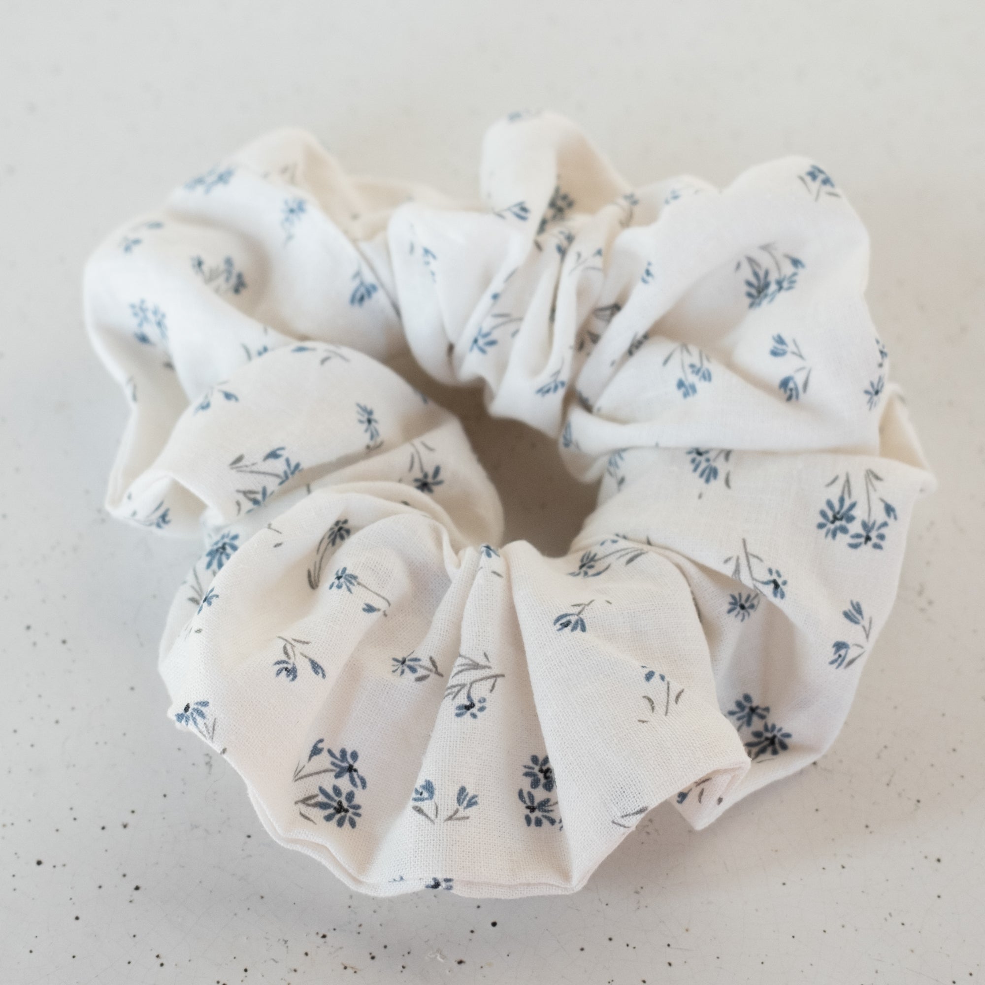 Floral patterned scrunchie on a light background