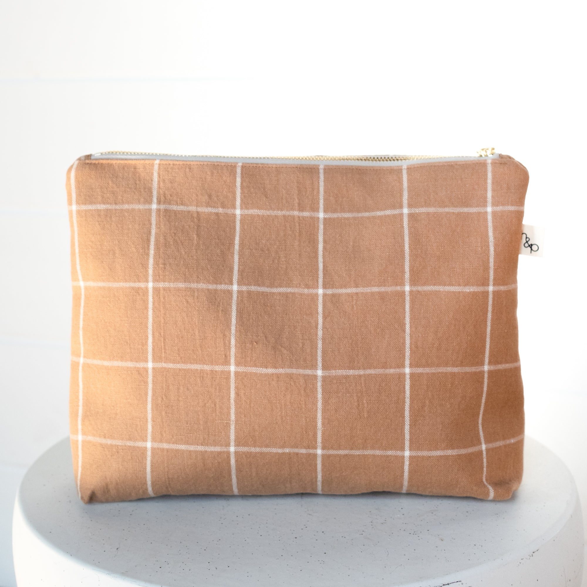 brown plaid pouch on a white background