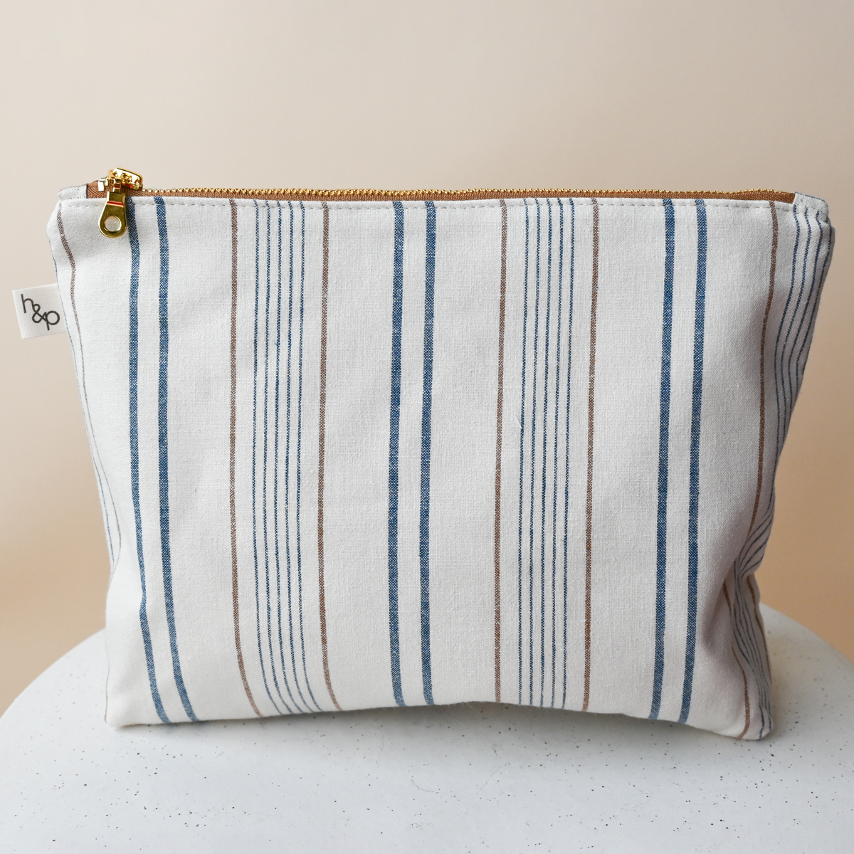 Large Flat Bottom Bag in Lugano, a standing zip pouch, cream woven chambray with blue stripes and fine rust pinstripes.
