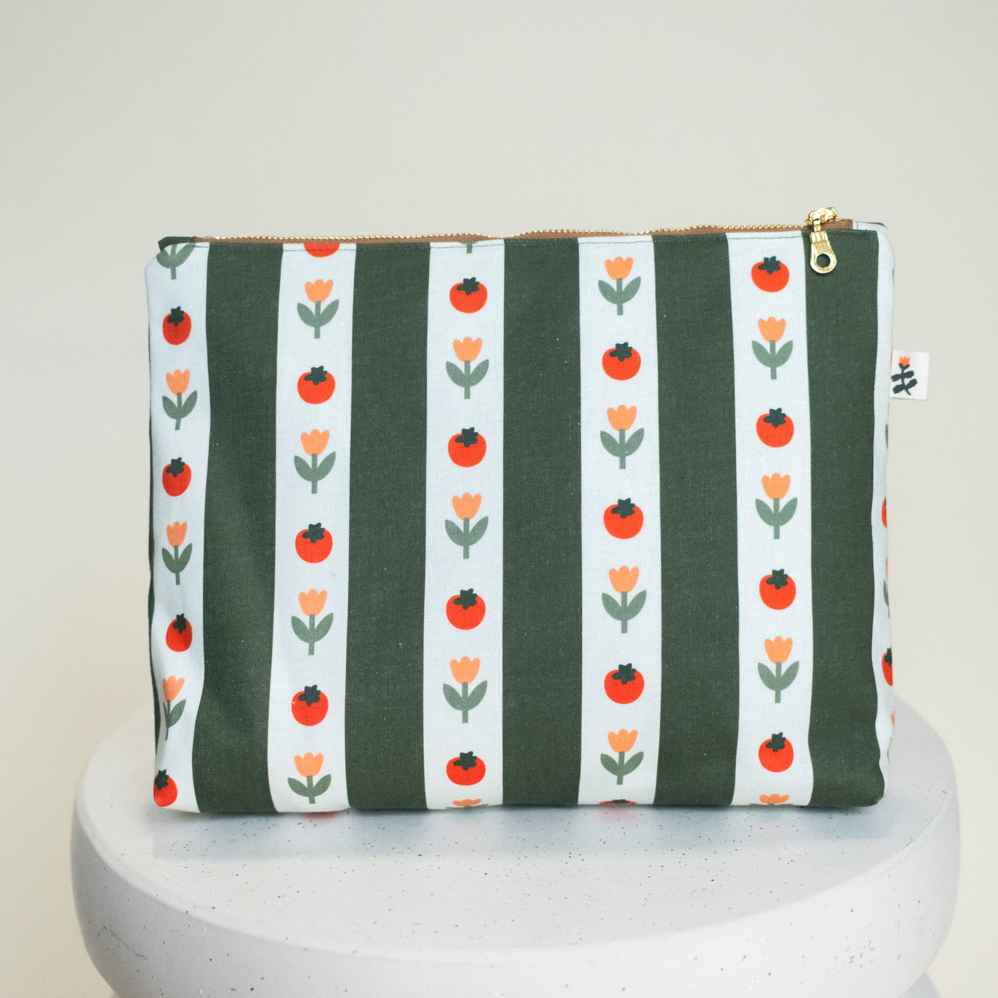 Large Flat Bottom Bag in Medley — olive-and-white striped fabric with illustrated orange tomatoes and peach tulips