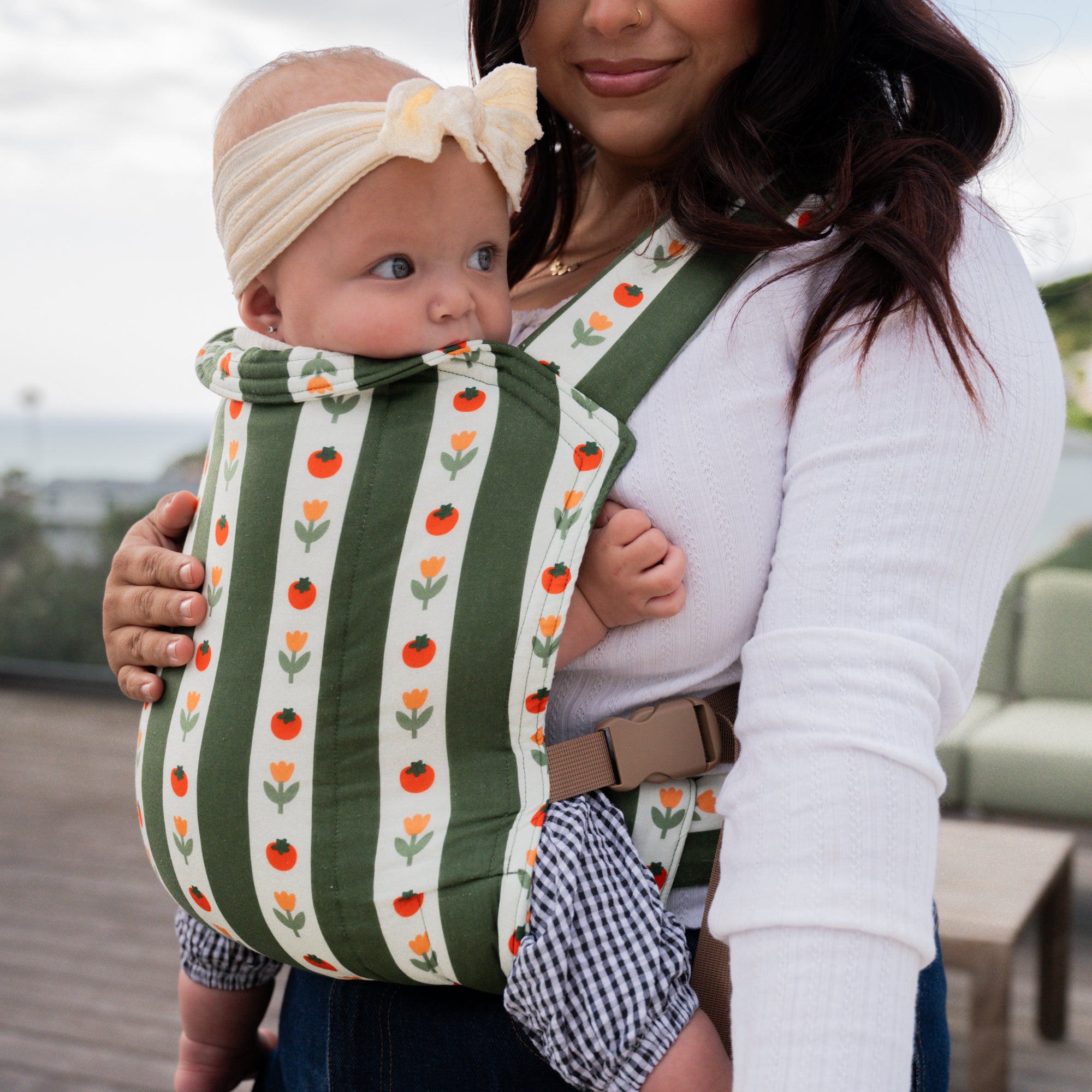 hope&plum Medley Lark buckle baby carrier olive green stripe with tomatoes and tulips in front carry position
