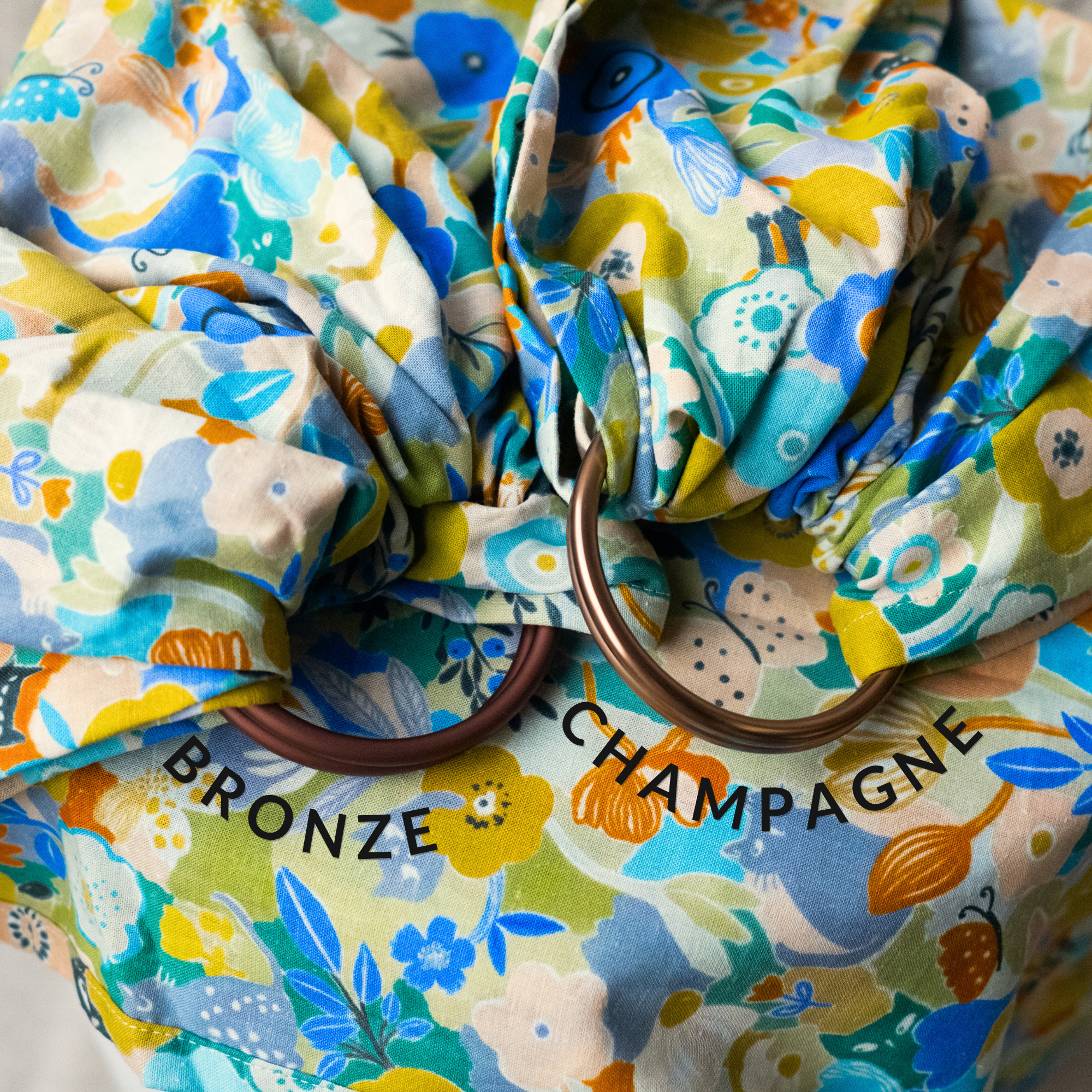 Floral-patterned fabric with bronze rings labeled 'Bronze' and 'Champagne'.