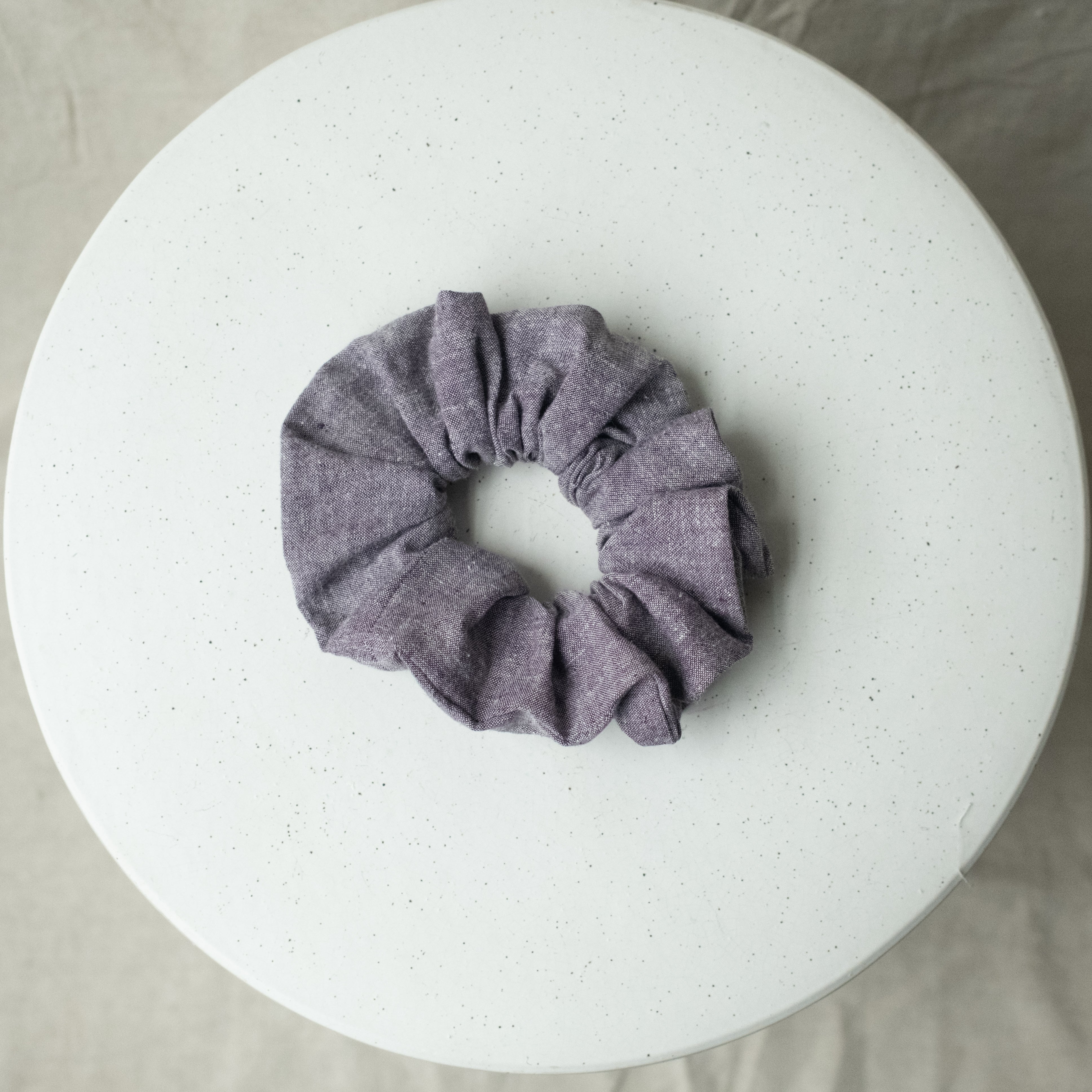 A single oversized scrunchie in purple chambray