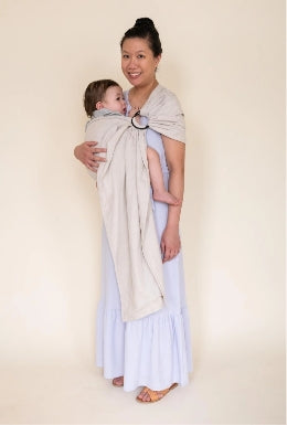 Asian mother wearing baby in gray ring sling baby carrier