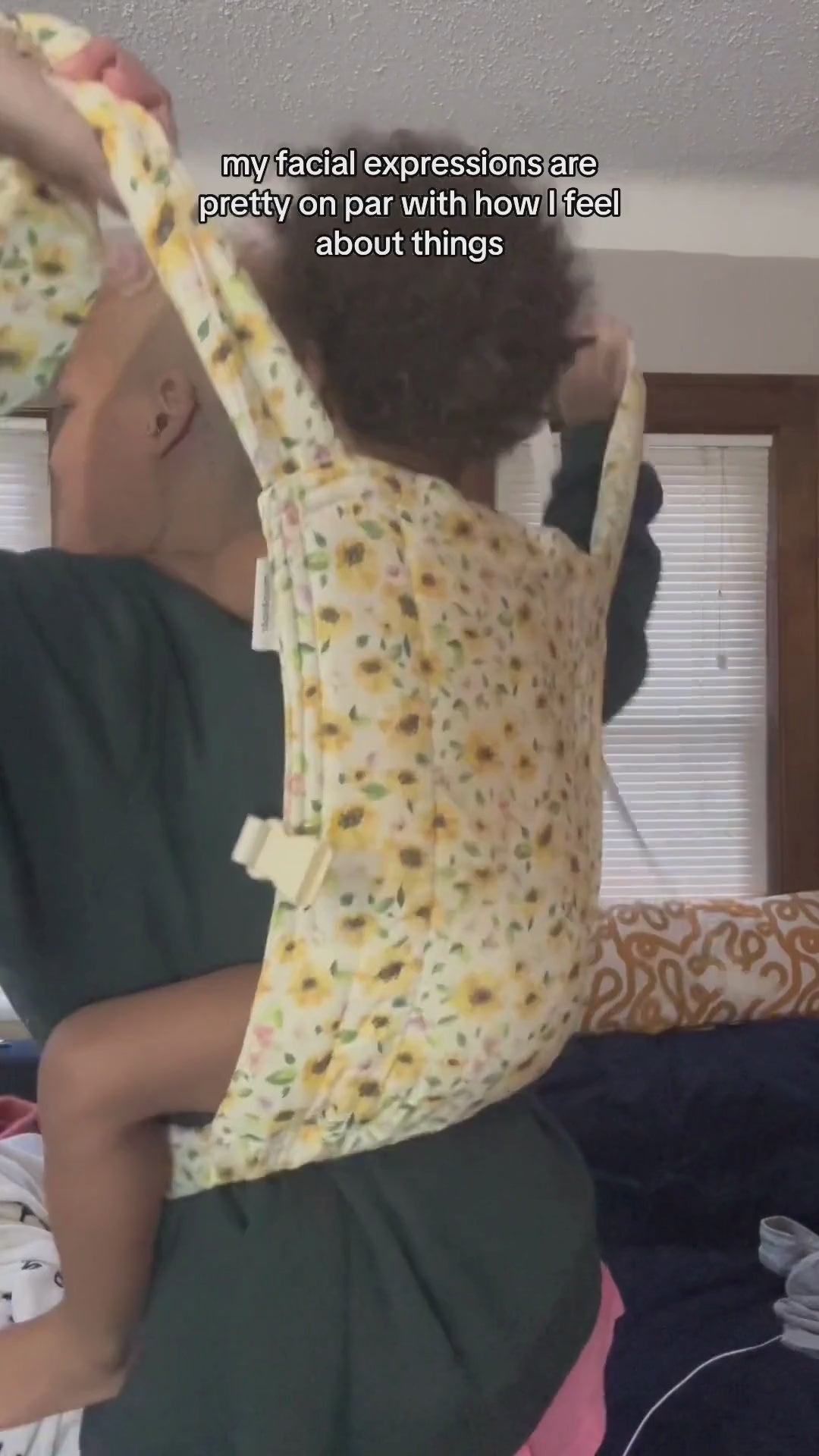 Plus size mother back carrying her toddler in a plus size lark baby carrier
