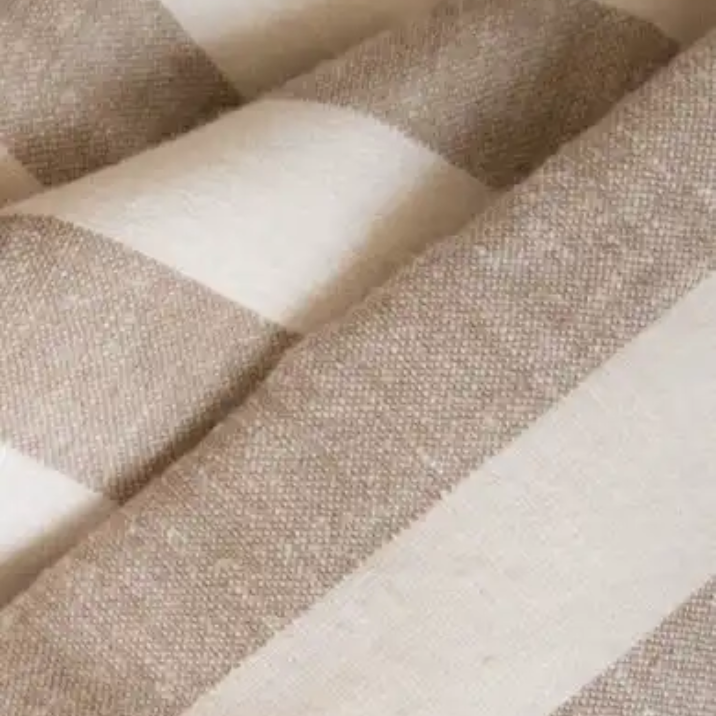 Folded tan and white printed ring sling