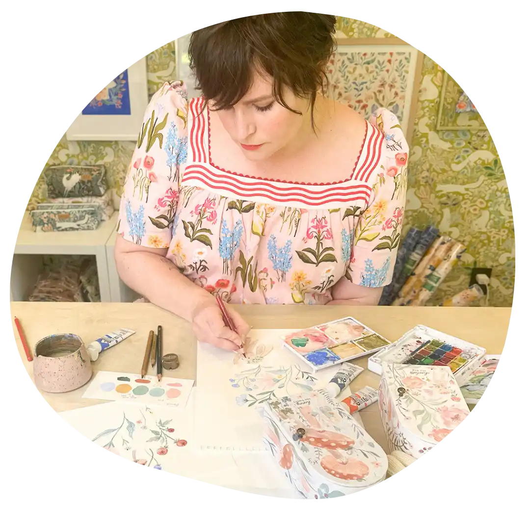 Woman drawing floral artwork.